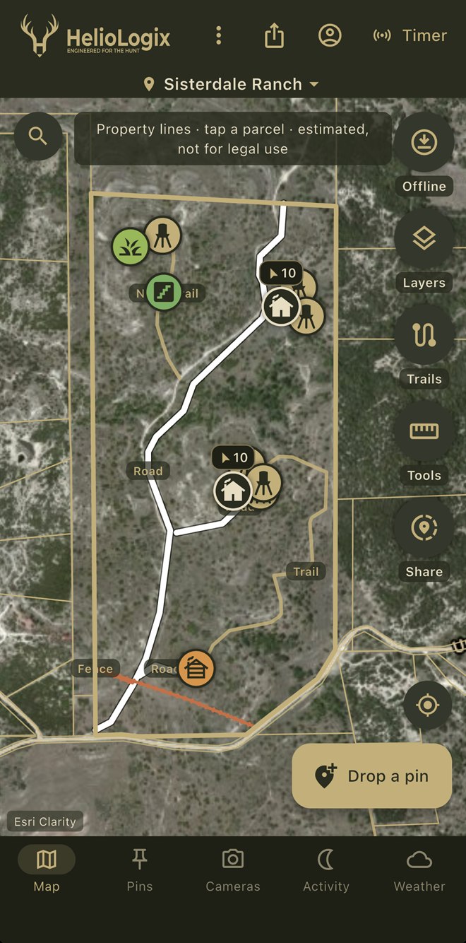 HelioMaps app showing Sisterdale Ranch — property lines, roads, trails and pins on satellite imagery